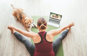 Dog-with-owner-on-yoga-mat